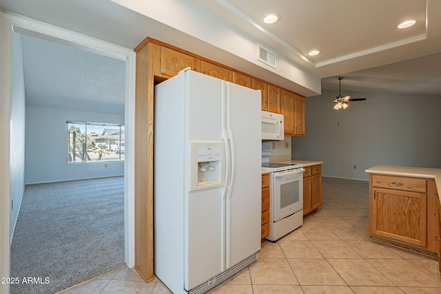 kitchen with ceiling fan, white appliances, and light carpet