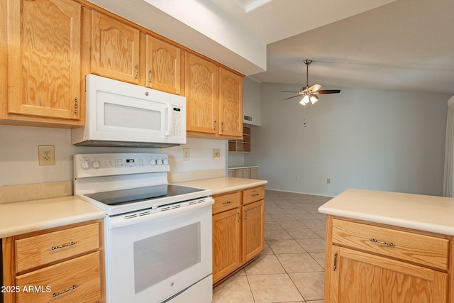 kitchen with ceiling fan, white appliances, vaulted ceiling, and light tile patterned floors