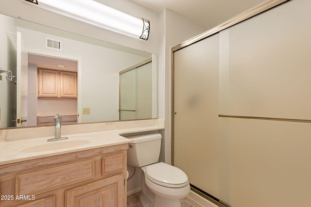 bathroom with walk in shower, vanity, and toilet