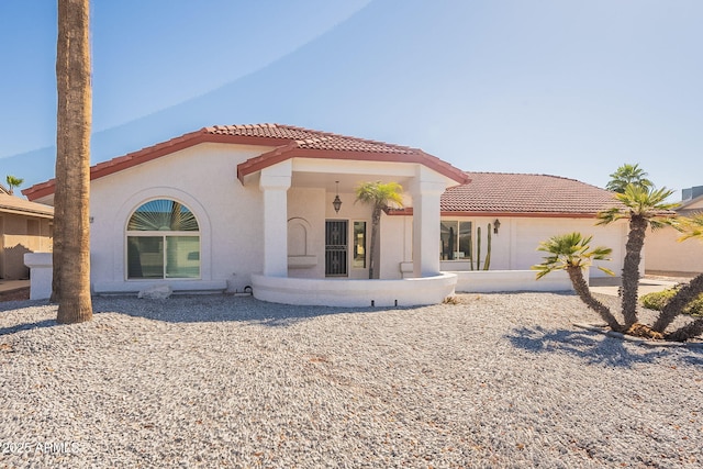 back of property featuring a garage