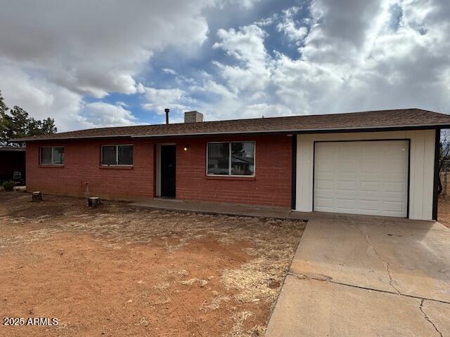 single story home with a garage