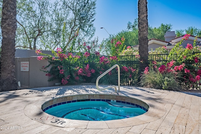 view of pool featuring a community hot tub