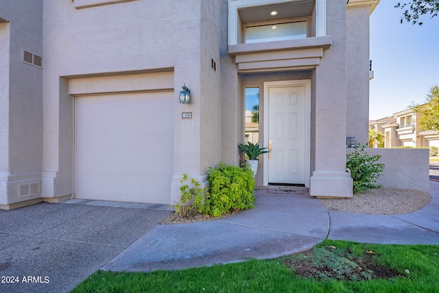 property entrance with a garage