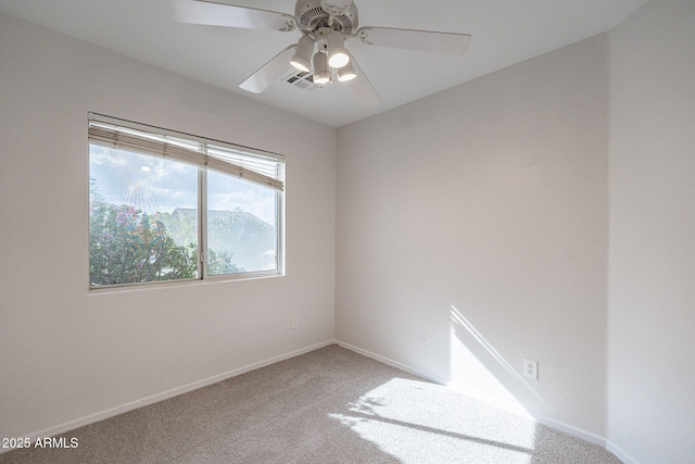 unfurnished room featuring ceiling fan and carpet flooring