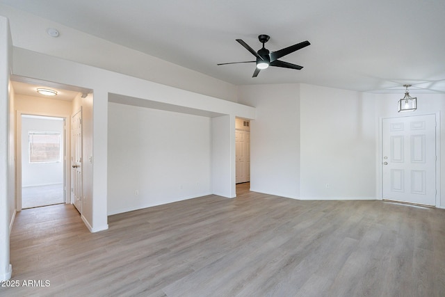 spare room featuring light wood-type flooring and ceiling fan