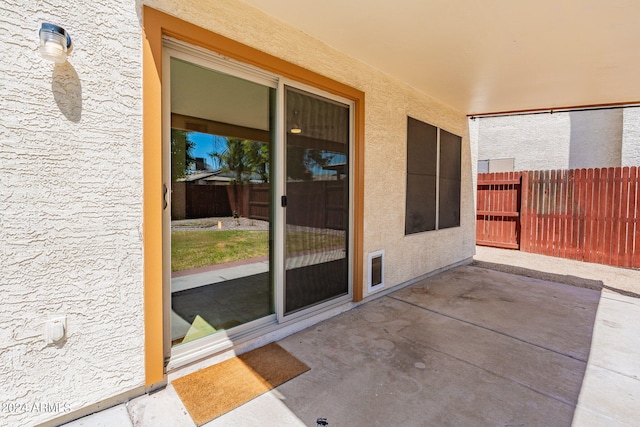 view of patio / terrace featuring fence