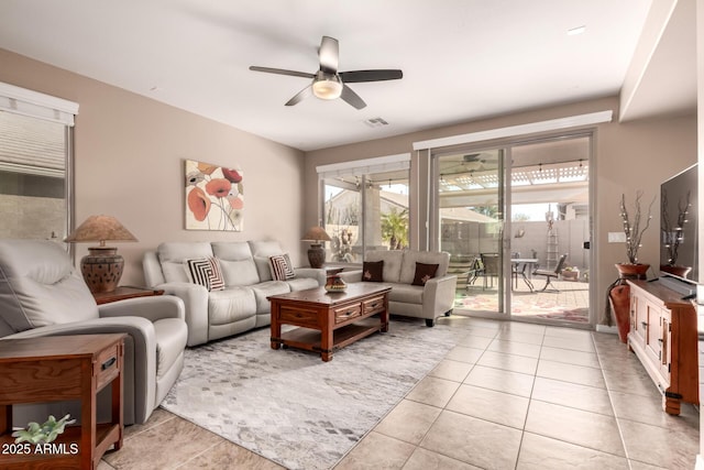 living room featuring ceiling fan and light tile patterned floors