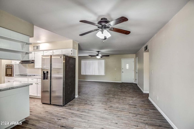 kitchen with white cabinetry, stainless steel refrigerator with ice dispenser, and hardwood / wood-style flooring