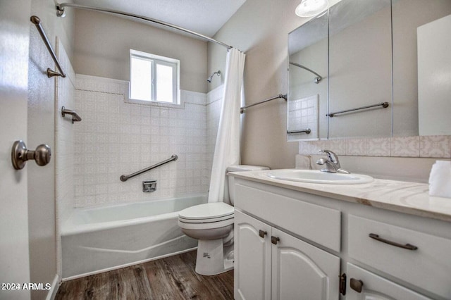 full bathroom featuring toilet, vanity, shower / bath combo with shower curtain, and hardwood / wood-style flooring