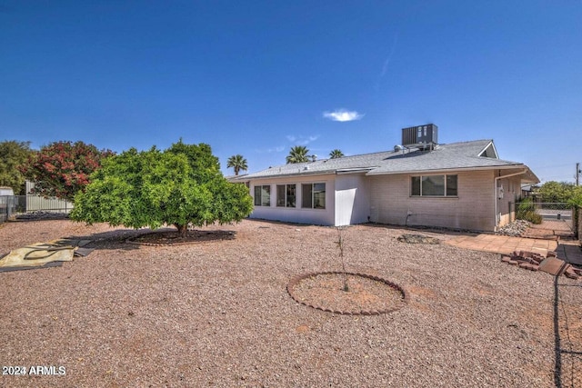 back of house with cooling unit and a patio