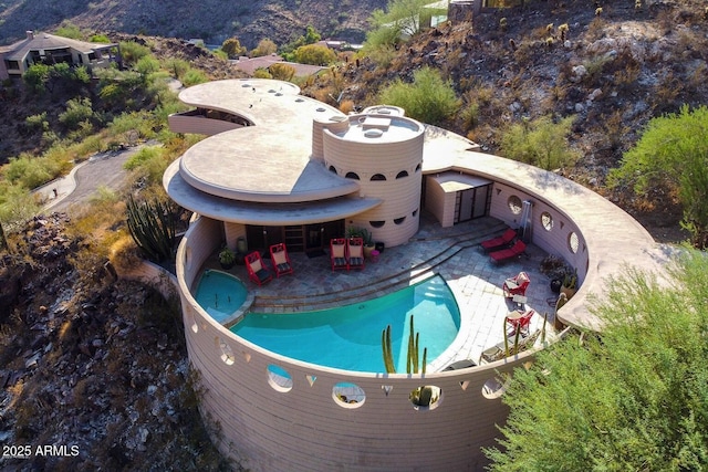 view of swimming pool featuring a patio