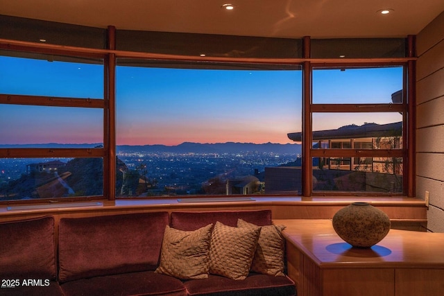 sunroom / solarium featuring a mountain view