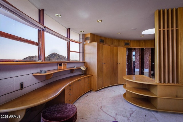 bathroom with wood walls