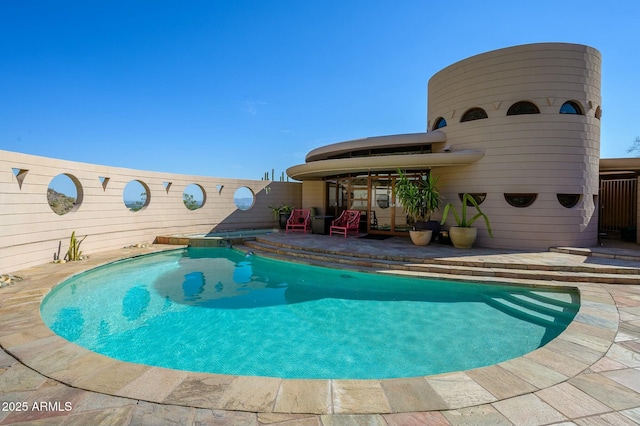 view of swimming pool featuring a patio area