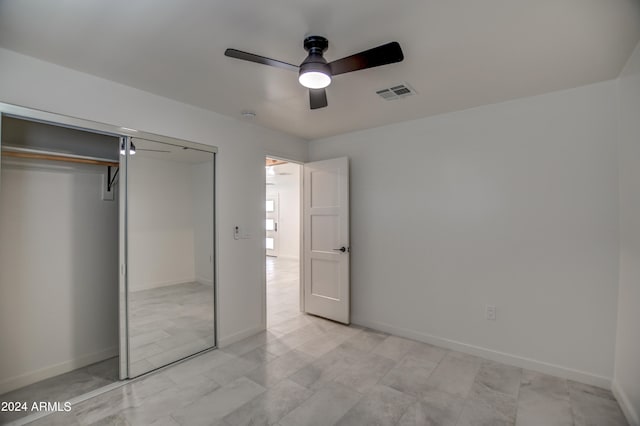 unfurnished bedroom featuring a closet, ceiling fan, and light tile floors