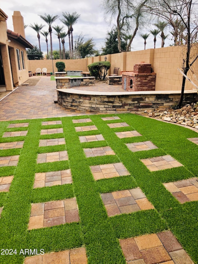 view of yard with area for grilling and a patio