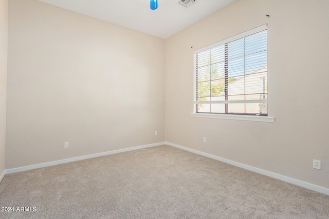 empty room featuring light colored carpet