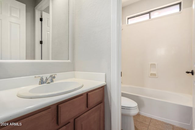 full bathroom featuring tile patterned flooring, vanity, toilet, and shower / washtub combination