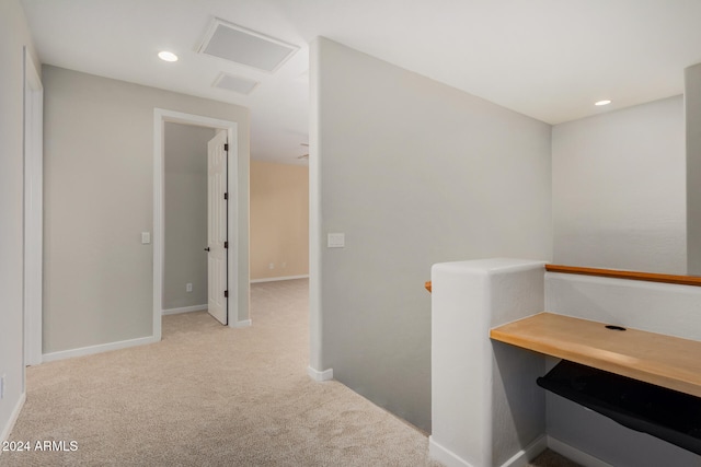 corridor with light colored carpet