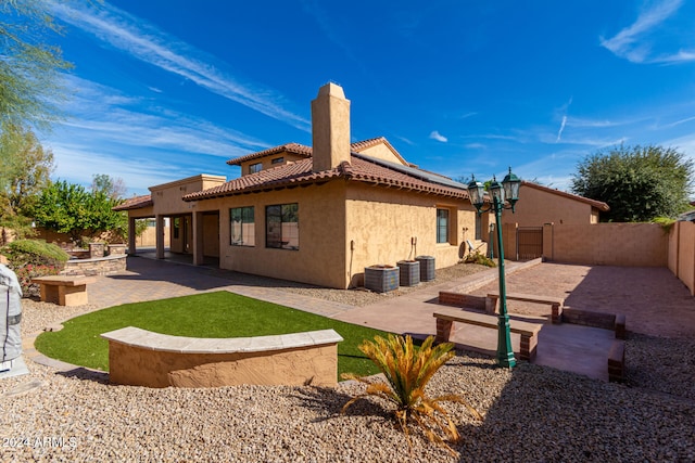 back of house featuring a patio