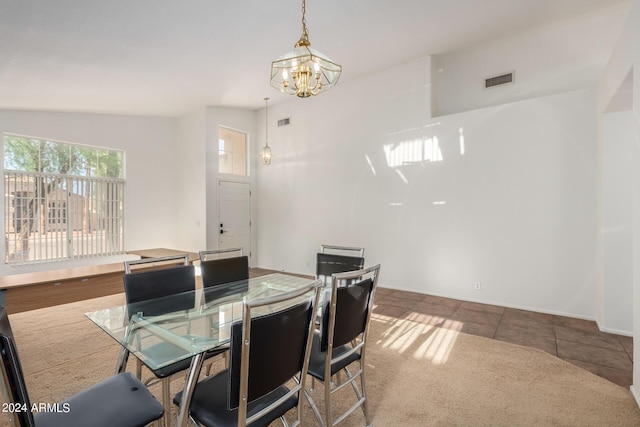 10735 W Bermuda Dr, Avondale, AZ 85392 - tiled dining space with a chandelier