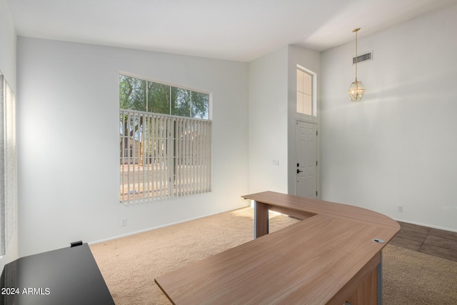 10735 W Bermuda Dr, Avondale, AZ 85392 - unfurnished living room with dark colored carpet and baseboards