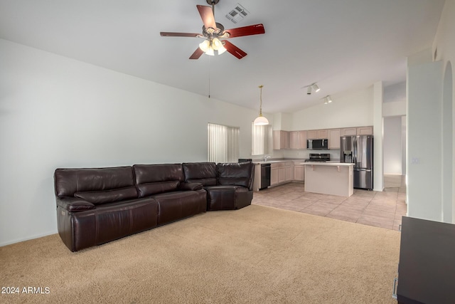 10735 W Bermuda Dr, Avondale, AZ 85392 - living room featuring light colored carpet, ceiling fan, high vaulted ceiling, and light tile patterned floors