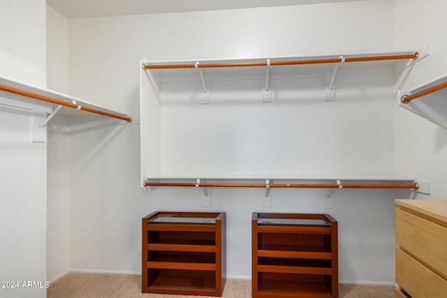 10735 W Bermuda Dr, Avondale, AZ 85392 - walk in closet featuring light colored carpet