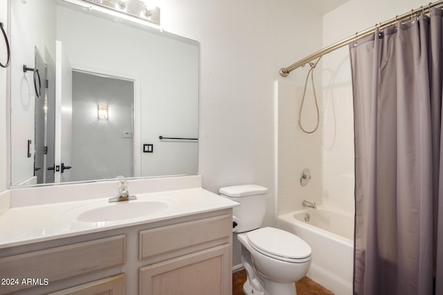 10735 W Bermuda Dr, Avondale, AZ 85392 - bathroom featuring toilet, shower / bathtub combination with curtain, and vanity