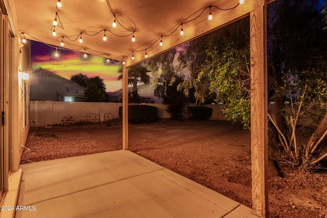 10735 W Bermuda Dr, Avondale, AZ 85392 - patio at night featuring a fenced backyard