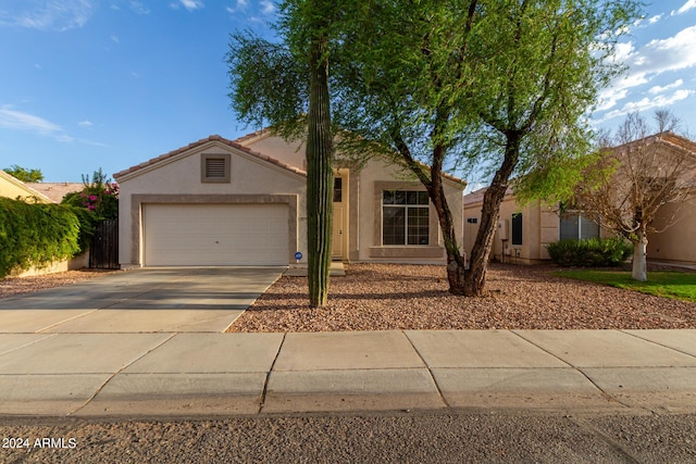 10735 W Bermuda Dr, Avondale, AZ 85392 - single story home featuring stucco siding, concrete driveway, a garage, and a tile roof