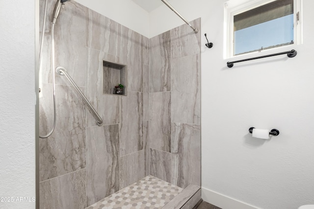 full bathroom featuring a tile shower