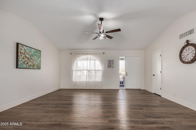 unfurnished room featuring baseboards, visible vents, ceiling fan, dark wood-style flooring, and vaulted ceiling