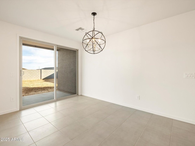 empty room with an inviting chandelier