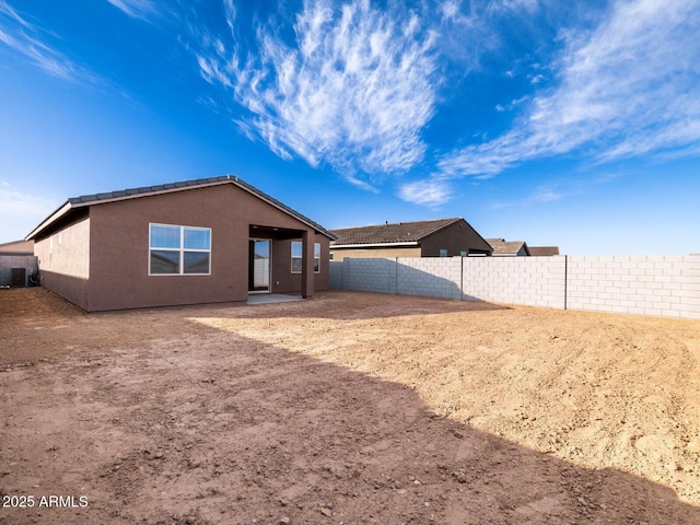 rear view of house with a patio