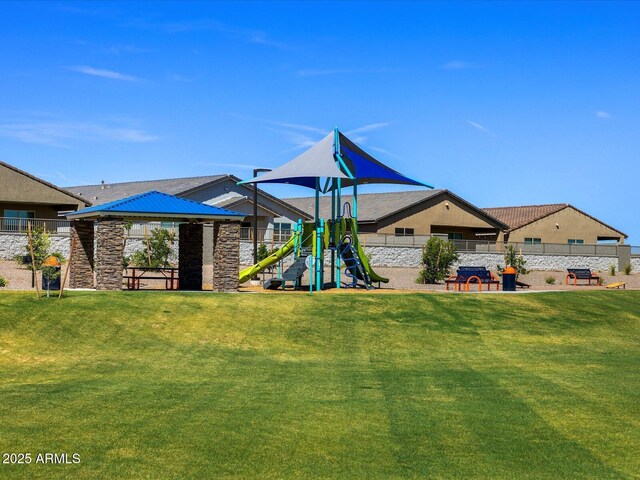 view of jungle gym with a gazebo and a lawn