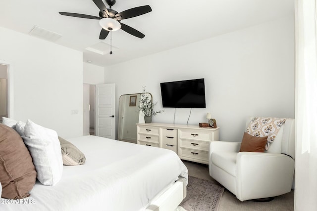 bedroom featuring light carpet and ceiling fan