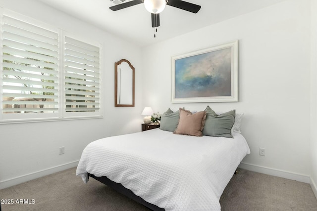 bedroom with carpet, baseboards, and a ceiling fan