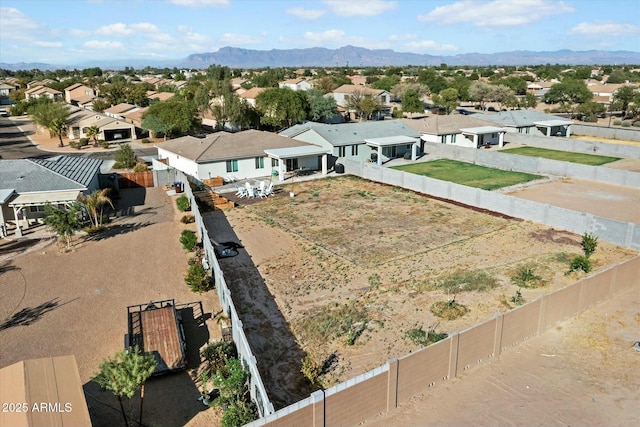 drone / aerial view featuring a residential view and a mountain view