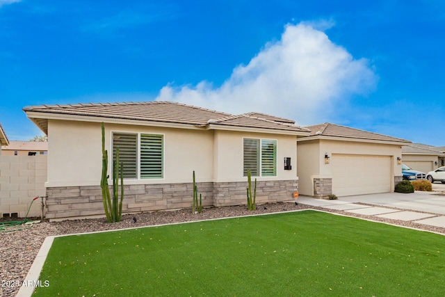 prairie-style house with concrete driveway, stone siding, an attached garage, fence, and stucco siding