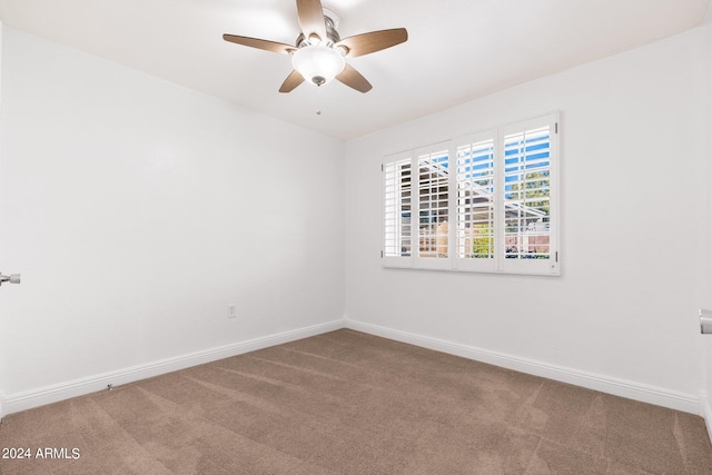 empty room with ceiling fan and carpet