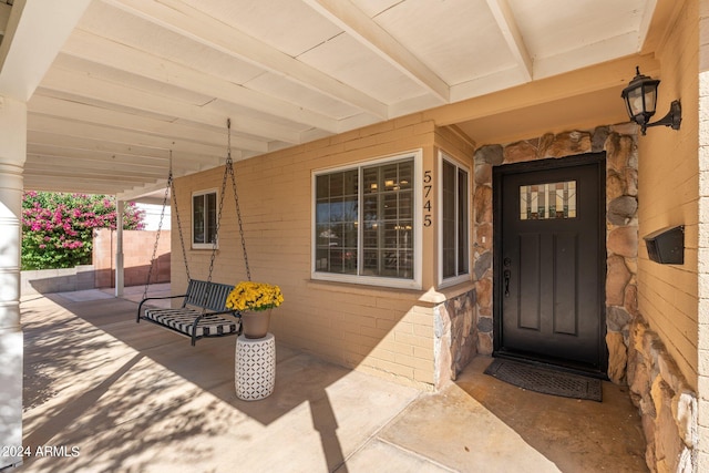 property entrance with a porch