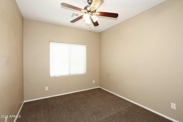 spare room featuring carpet flooring and ceiling fan