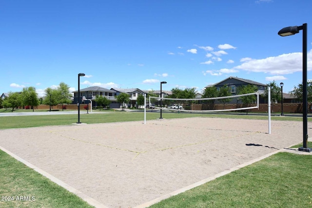 view of home's community with a yard and volleyball court