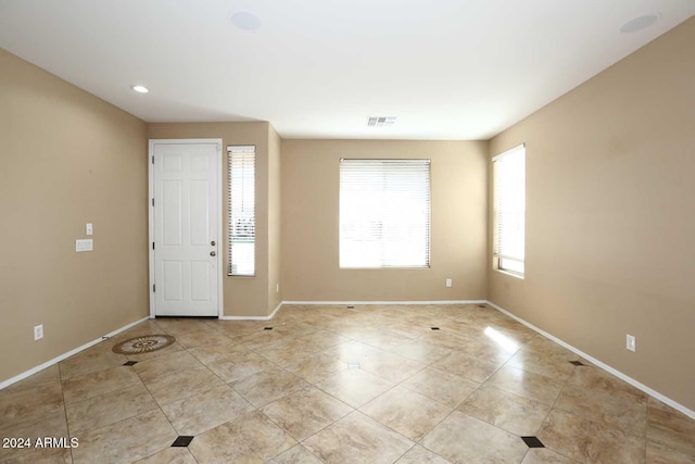 entrance foyer featuring light tile patterned flooring