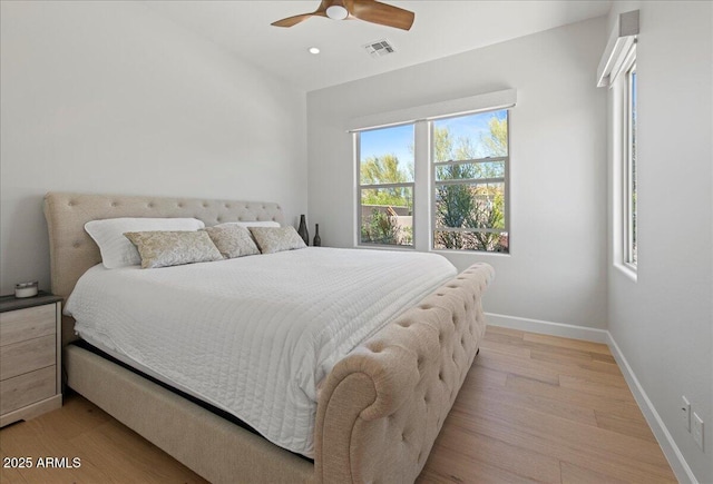 bedroom with a ceiling fan, light wood finished floors, baseboards, visible vents, and recessed lighting