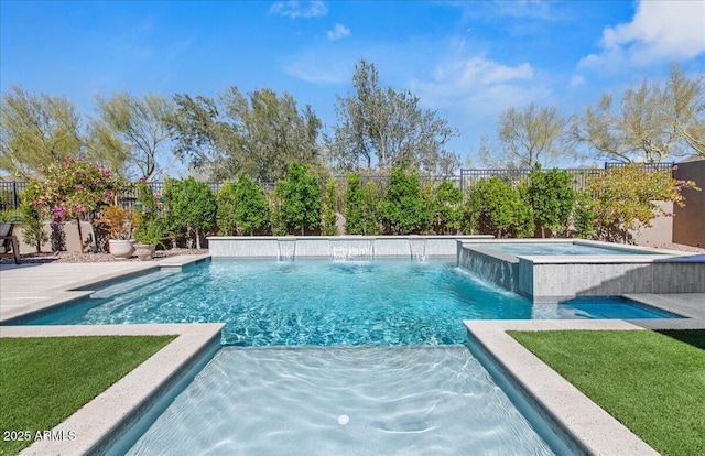view of swimming pool with a lawn, a fenced in pool, a fenced backyard, and an in ground hot tub