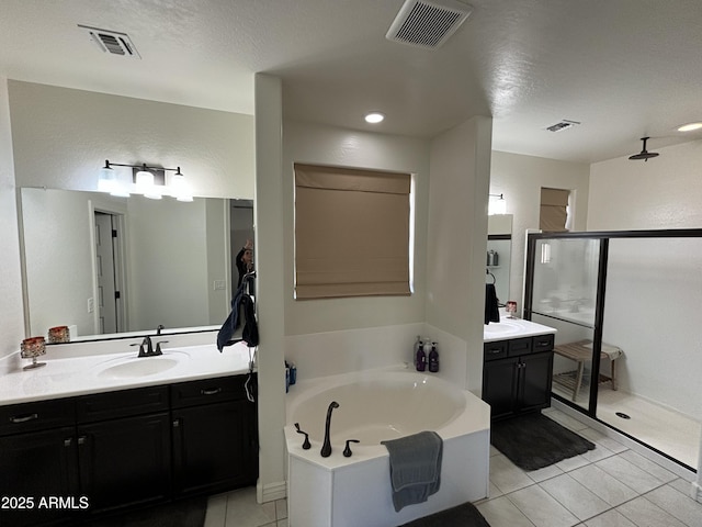 full bath featuring visible vents, a shower stall, vanity, and a bath