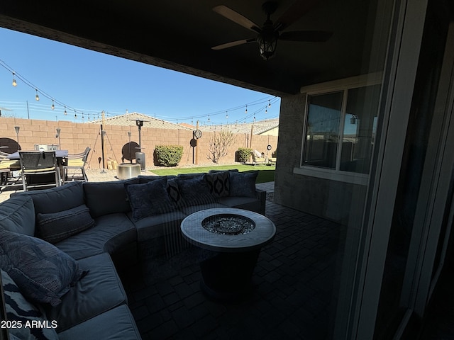 view of patio / terrace with ceiling fan, outdoor dining space, an outdoor hangout area, and a fenced backyard