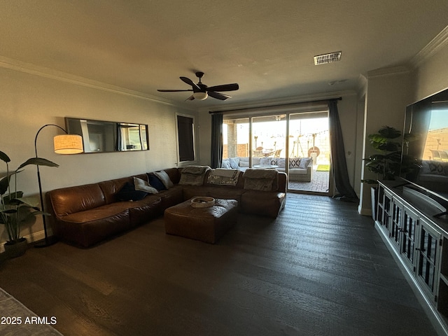 living area with a ceiling fan, visible vents, crown molding, and wood finished floors